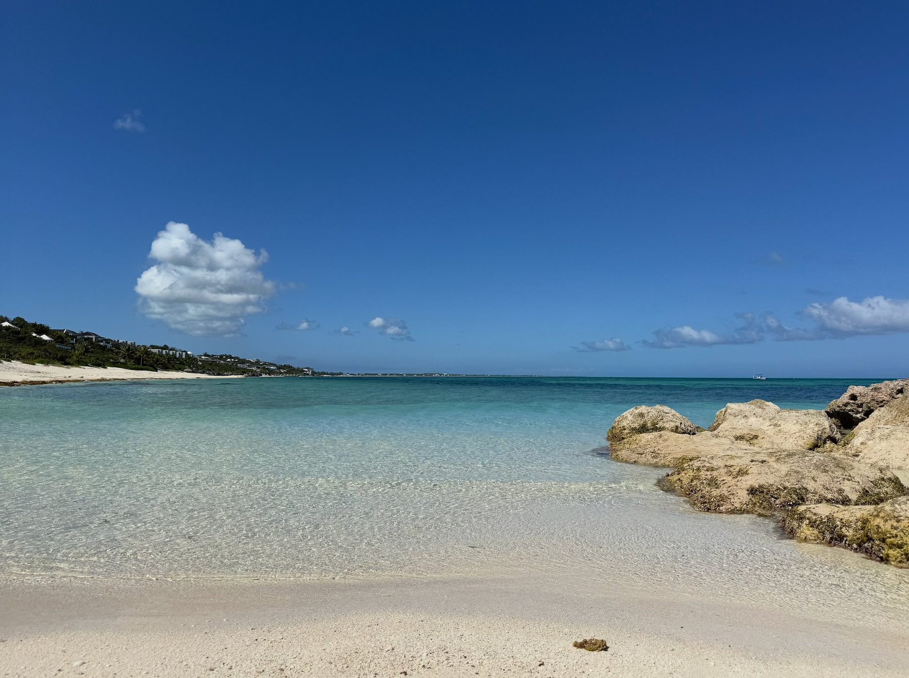 The clear turquoise water and white sand of Babalua Beach, a quiet cove a five-minute walk from Beachwood Villa, Providenciales Turks and Caicos