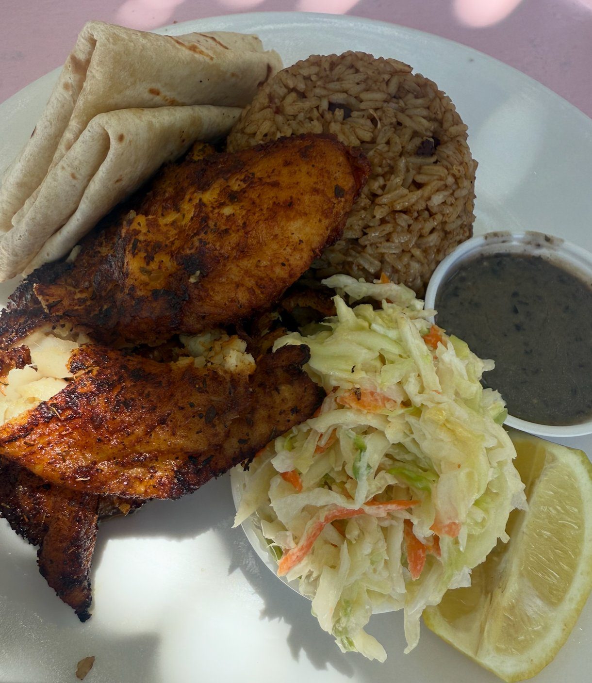 Blackened grilled fish with peas and rice, coleslaw and johnnycake at da Conch Shack, Turks and Caicos