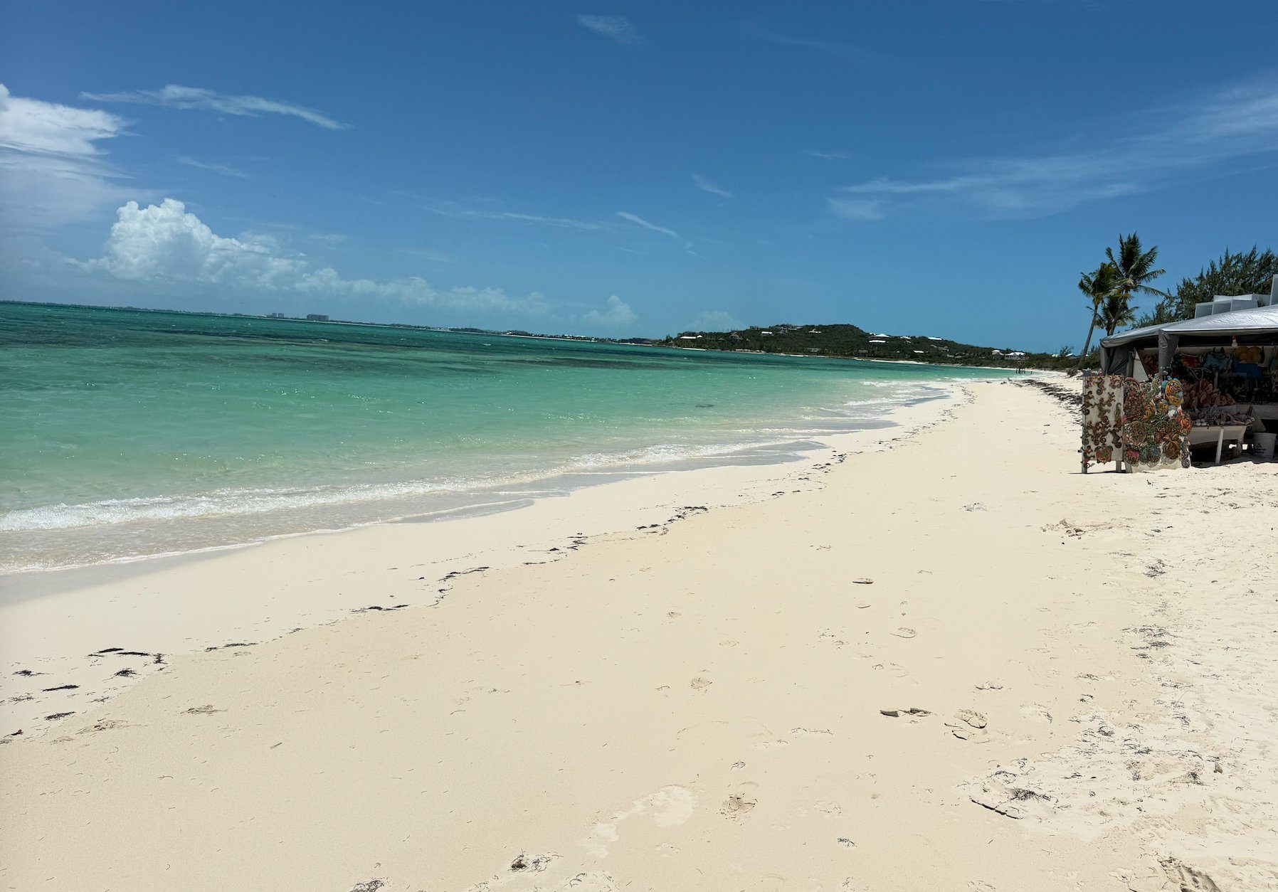 The wide white sand and turquoise water of Blue Hills Beach beside da Conch Shack, Providenciales Turks and Caicos