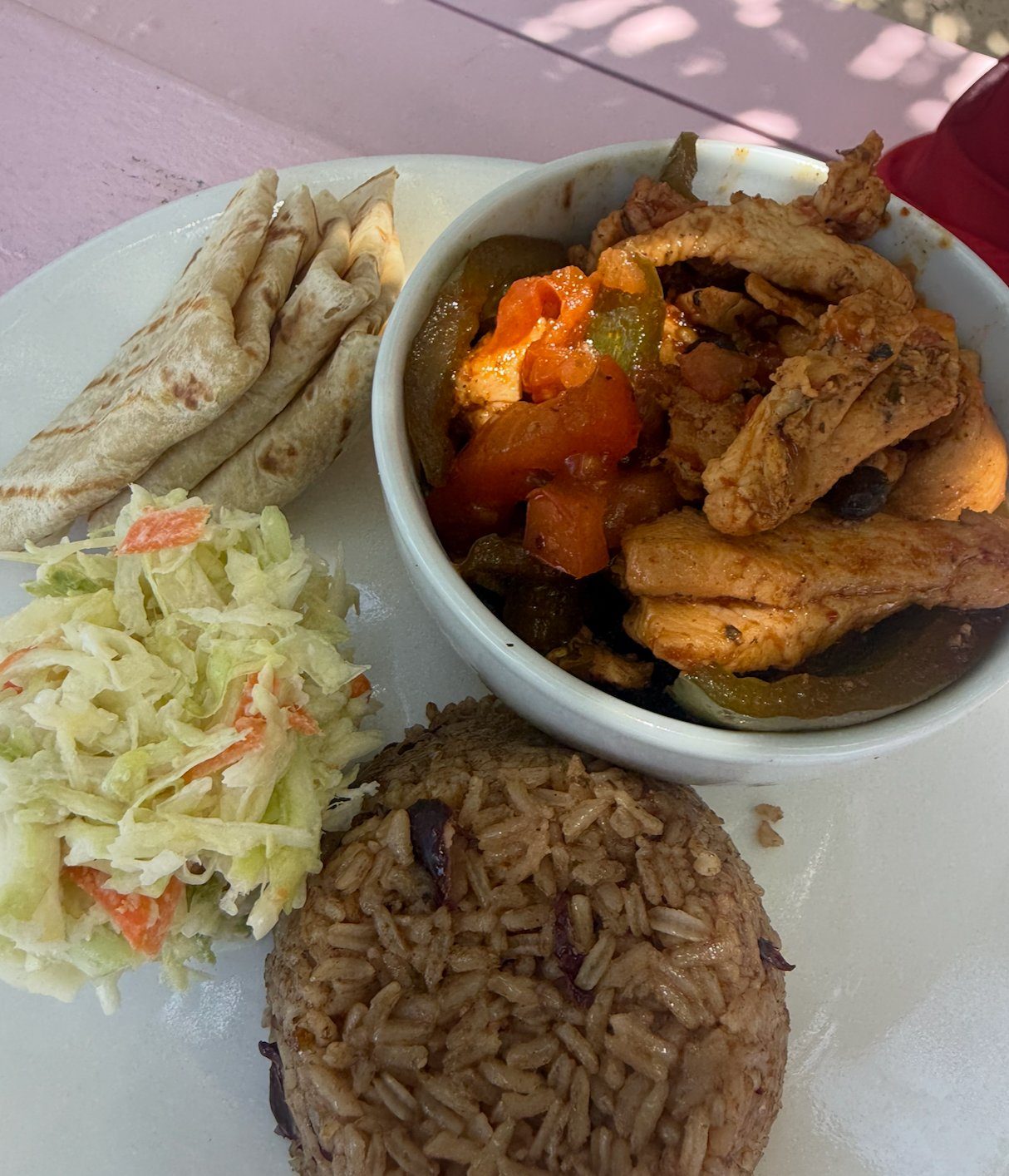 Stewed chicken with peppers, peas and rice, coleslaw and johnnycake at da Conch Shack, Turks and Caicos