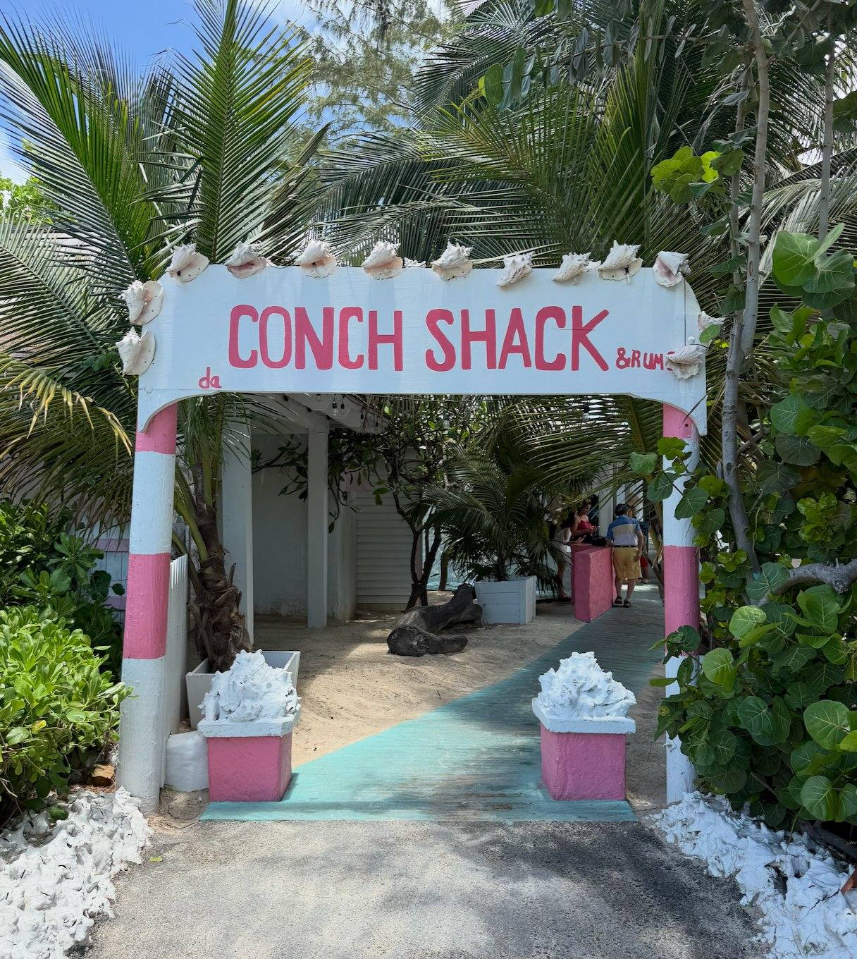 The painted Conch Shack & Rum Bar entrance sign at da Conch Shack, Blue Hills Beach, Providenciales