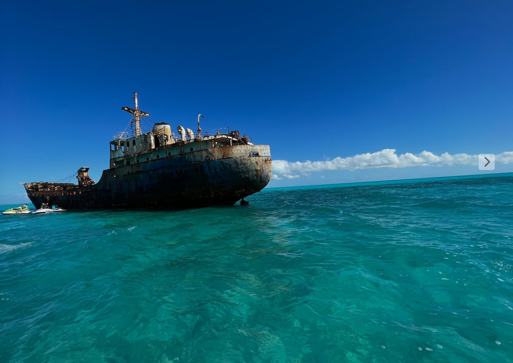 The grounded cargo-ship wreck off Providenciales in clear turquoise water, Turks and Caicos
