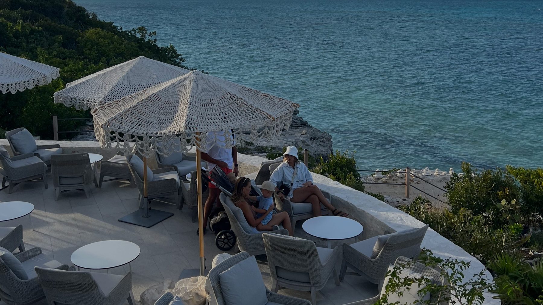 An elevated oceanfront dining terrace at sunset on the North Shore of Providenciales, Turks and Caicos